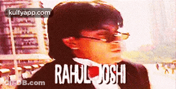 A Man Wearing Sunglasses And A Tuxedo With The Name Rahul Joshi Written On The Bottom GIF