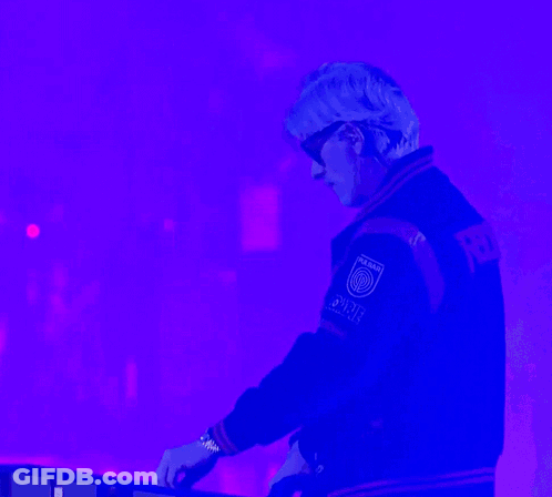 A Man Wearing Sunglasses And A Varsity Jacket That Says Power On The Back GIF