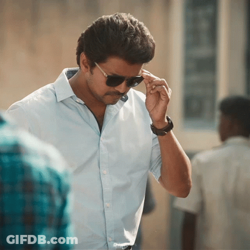 A Man Wearing Sunglasses And A Watch Adjusts His Sunglasses GIF