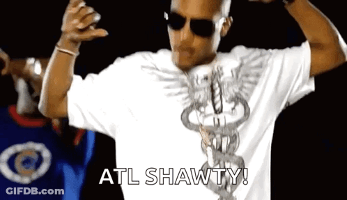 A Man Wearing Sunglasses And A White Shirt With The Word Atl Shawty On It . GIF