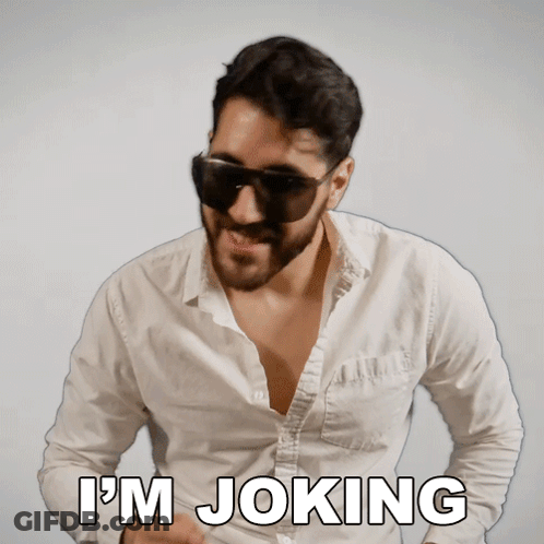 A Man Wearing Sunglasses And A White Shirt With The Words I 'M Joking GIF