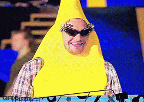 A Man Wearing Sunglasses And A Yellow Banana Costume Is Smiling GIF