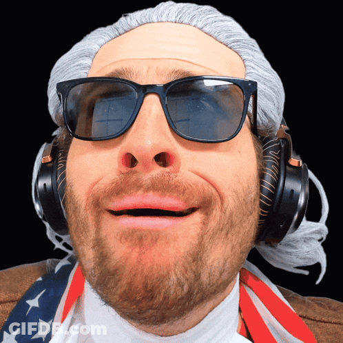 A Man Wearing Sunglasses And Headphones Is Making A Face GIF
