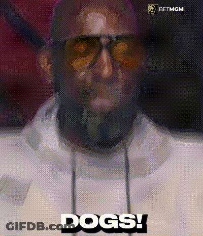 A Man Wearing Sunglasses And Headphones Is Saying Dogs ! GIF