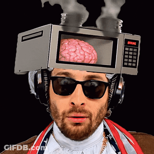 A Man Wearing Sunglasses And Headphones With A Microwave On His Head That Says Brains GIF