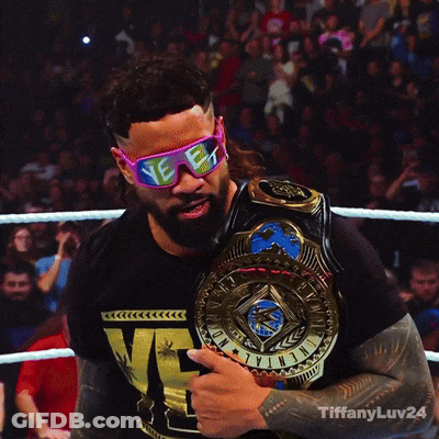 A Man Wearing Sunglasses And Holding A Championship Belt With Tiffanyluv24 Written Below Him GIF