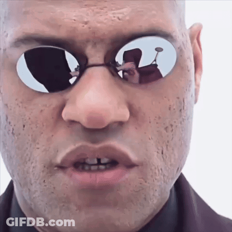 A Man Wearing Sunglasses Has A Reflection Of Another Man In His Glasses GIF