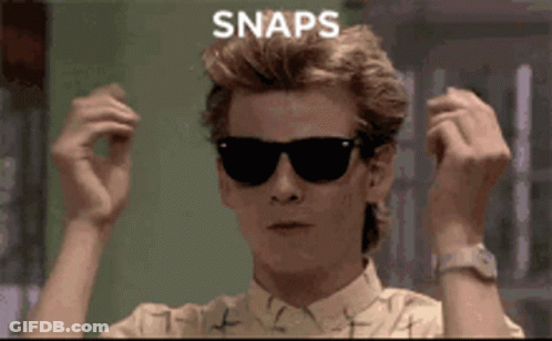 A Man Wearing Sunglasses Has The Word Snaps Written On His Head GIF