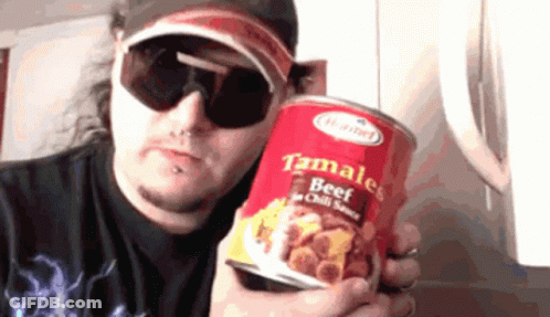 A Man Wearing Sunglasses Holds A Can Of Tamales Beef In Chili Sauce GIF