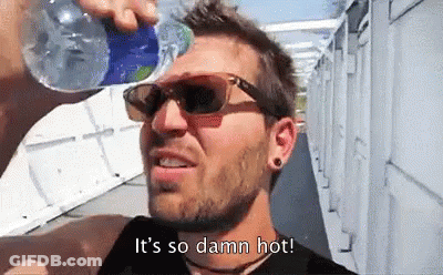 A Man Wearing Sunglasses Is Drinking Water From A Bottle And Says It 'S So Damn Hot . GIF