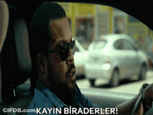 A Man Wearing Sunglasses Is Driving A Car And Says Kayin Biraderler ! GIF