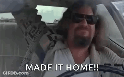 A Man Wearing Sunglasses Is Driving A Car And Says `` Made It Home ! '' GIF