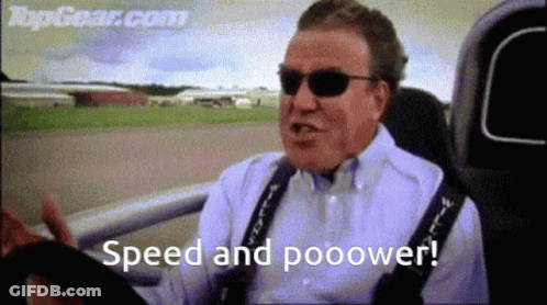 A Man Wearing Sunglasses Is Driving A Car And Says Speed And Pooower . GIF