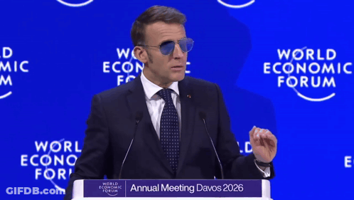 A Man Wearing Sunglasses Is Giving A Speech At The Annual Meeting Of The World Economic Forum GIF