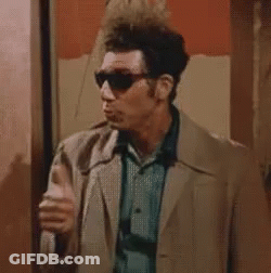 A Man Wearing Sunglasses Is Giving A Thumbs Up . GIF