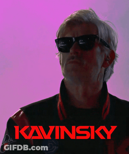 A Man Wearing Sunglasses Is Giving The Middle Finger In Front Of A Kavinsky Logo GIF