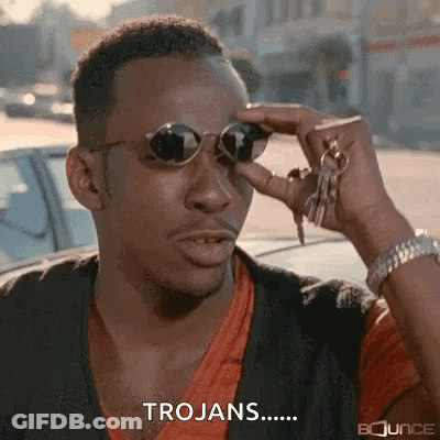 A Man Wearing Sunglasses Is Holding A Bunch Of Keys And Saying Trojans . GIF