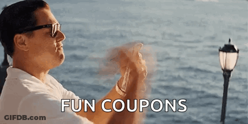 A Man Wearing Sunglasses Is Holding A Cell Phone In Front Of The Ocean And The Words Fun Coupons Are Above Him . GIF