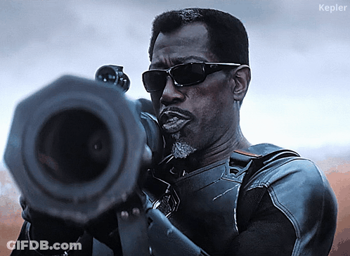 A Man Wearing Sunglasses Is Holding A Gun And The Word Kepler Is On The Bottom Right GIF