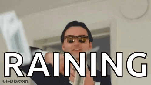 A Man Wearing Sunglasses Is Holding A Piece Of Paper With The Word Raining Written On It . GIF