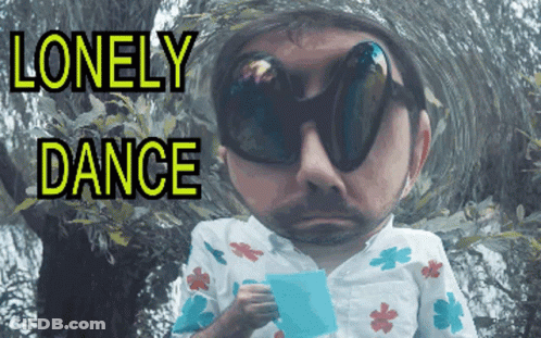 A Man Wearing Sunglasses Is Holding A Piece Of Paper With The Words Lonely Dance Written Above Him GIF