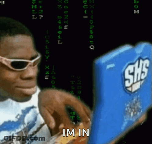 A Man Wearing Sunglasses Is Looking At A Shs Device GIF