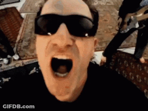 A Man Wearing Sunglasses Is Making A Funny Face With His Mouth Wide Open . GIF