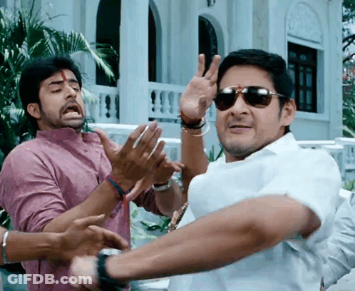 A Man Wearing Sunglasses Is Making A Peace Sign With His Hands GIF