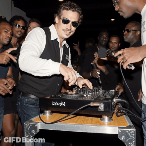 A Man Wearing Sunglasses Is Playing Music On A Dj Mixer That Says Daimler GIF