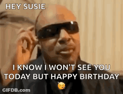A Man Wearing Sunglasses Is Saying Hey Susie I Know I Won 'T See You Today But Happy Birthday . GIF