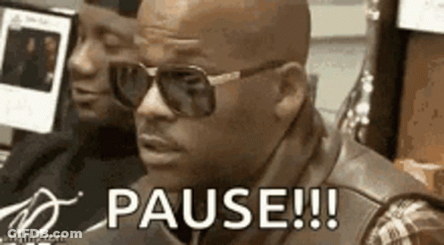 A Man Wearing Sunglasses Is Sitting In Front Of A Computer And Says `` Pause !!! '' . GIF