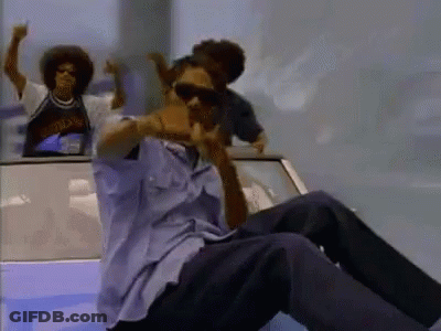 A Man Wearing Sunglasses Is Sitting In The Back Of A Car With Two Other Men GIF