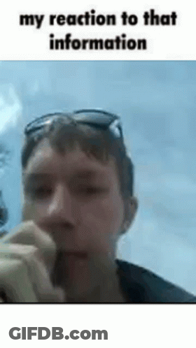 A Man Wearing Sunglasses Is Smoking A Cigarette In A Gif . GIF