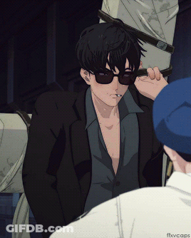 A Man Wearing Sunglasses Is Smoking A Cigarette While Another Man Watches GIF