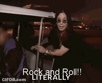 A Man Wearing Sunglasses Is Standing In A Golf Cart And Says `` Rock And Roll ! '' GIF