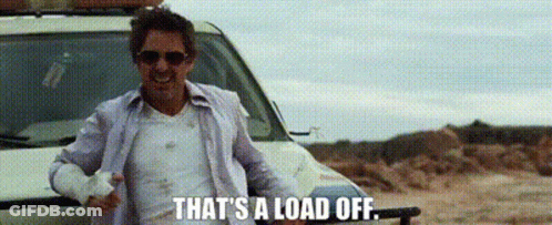 A Man Wearing Sunglasses Is Standing Next To A Car And Says `` That 'S A Load Off '' . GIF