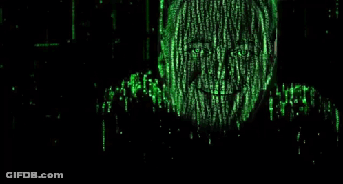 A Man Wearing Sunglasses Is Surrounded By Green Matrix Code And Is Smiling . GIF