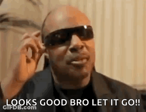 A Man Wearing Sunglasses Is Talking On A Cell Phone And Says `` Looks Good Bro Let It Go ! '' GIF
