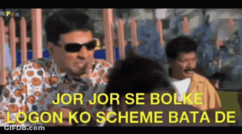 A Man Wearing Sunglasses Is Talking To Another Man In A Room . GIF