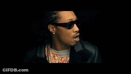 A Man Wearing Sunglasses Looks At The Camera GIF