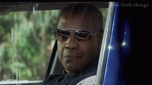 A Man Wearing Sunglasses Looks Out Of A Blue Car Window With The Words The Little Things Below Him GIF