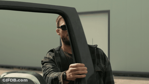 Man Wearing Sunglasses Opening Vehicle Door GIF