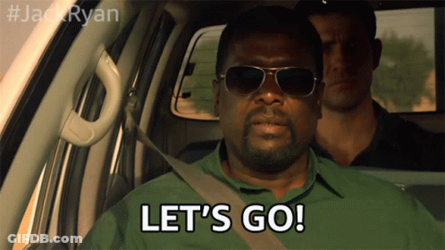 A Man Wearing Sunglasses Says Let 'S Go While Sitting In A Car GIF