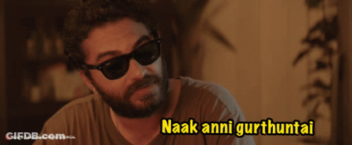 A Man Wearing Sunglasses Says Naak Anni Gurthuntai In Yellow Letters GIF
