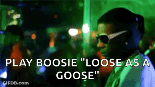A Man Wearing Sunglasses Says Play Boosie " Loose As A Goose " In Front Of A Crowd GIF