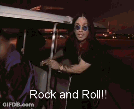 A Man Wearing Sunglasses Says Rock And Roll In Front Of A Golf Cart GIF