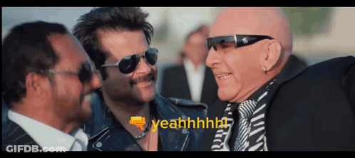 A Man Wearing Sunglasses Says " Yeahhhhh " While Talking To Two Other Men GIF