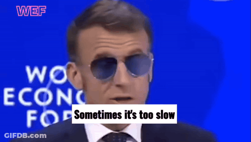A Man Wearing Sunglasses Stands In Front Of A Blue Background That Says Work Econo For And Need To Be Reformed GIF
