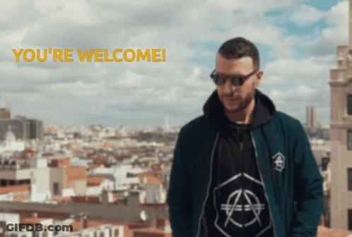 A Man Wearing Sunglasses Stands In Front Of A City With The Words " You 'Re Welcome " Below Him GIF