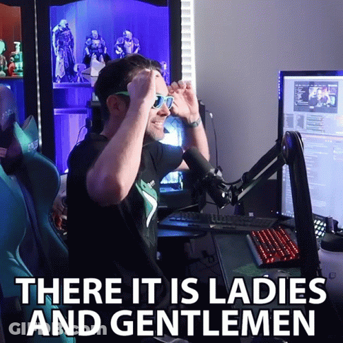 A Man Wearing Sunglasses Stands In Front Of A Microphone With The Words There It Is Ladies And Gentlemen Above Him GIF